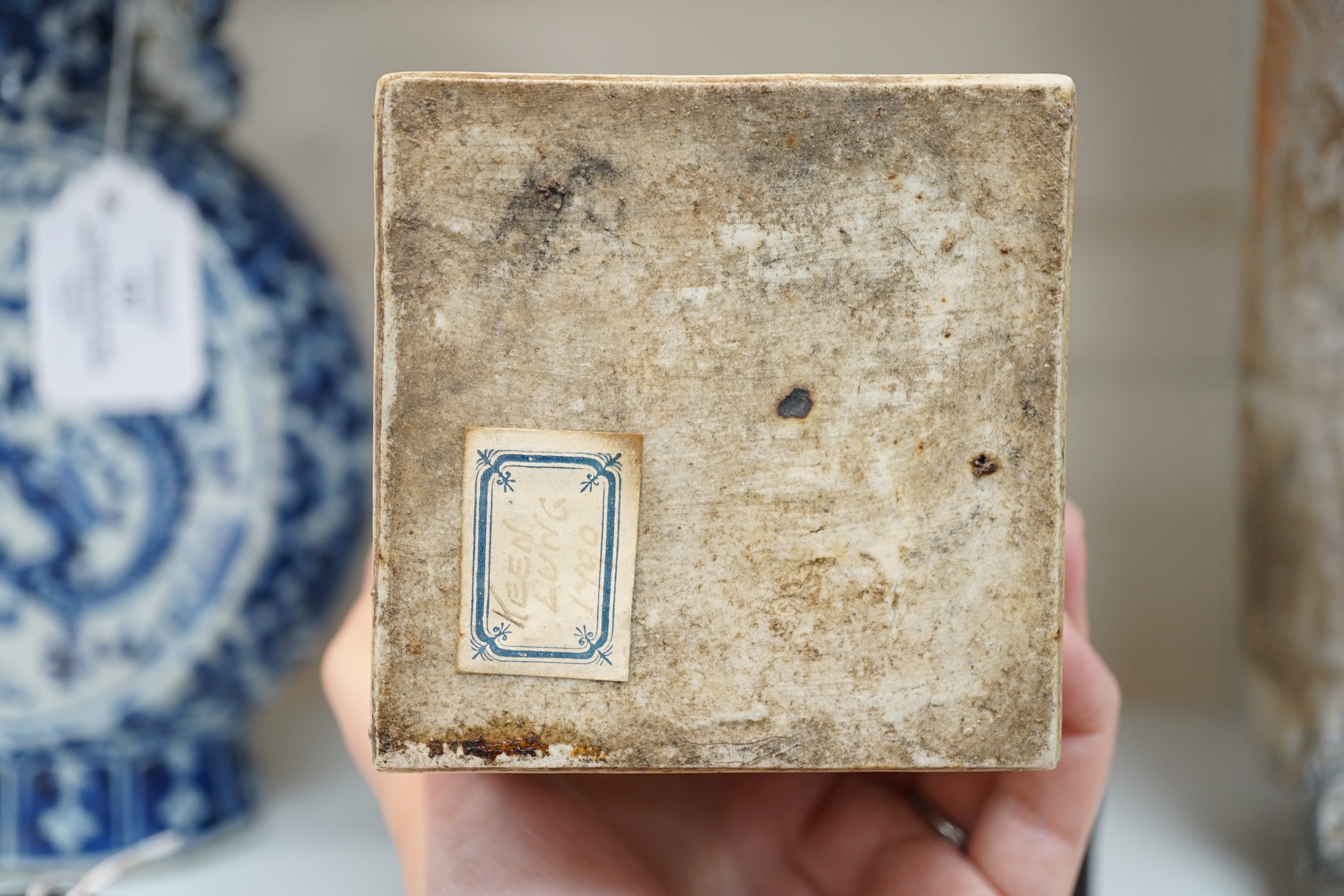 A Chinese famille rose square tea caddy, mid 19th century, 13.7cm high excluding wood stand and cover, slight damage